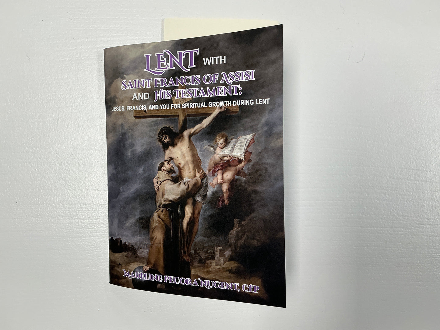 Booklet titled 'Lent with Saint Francis of Assisi and the Testament' on a textured white background