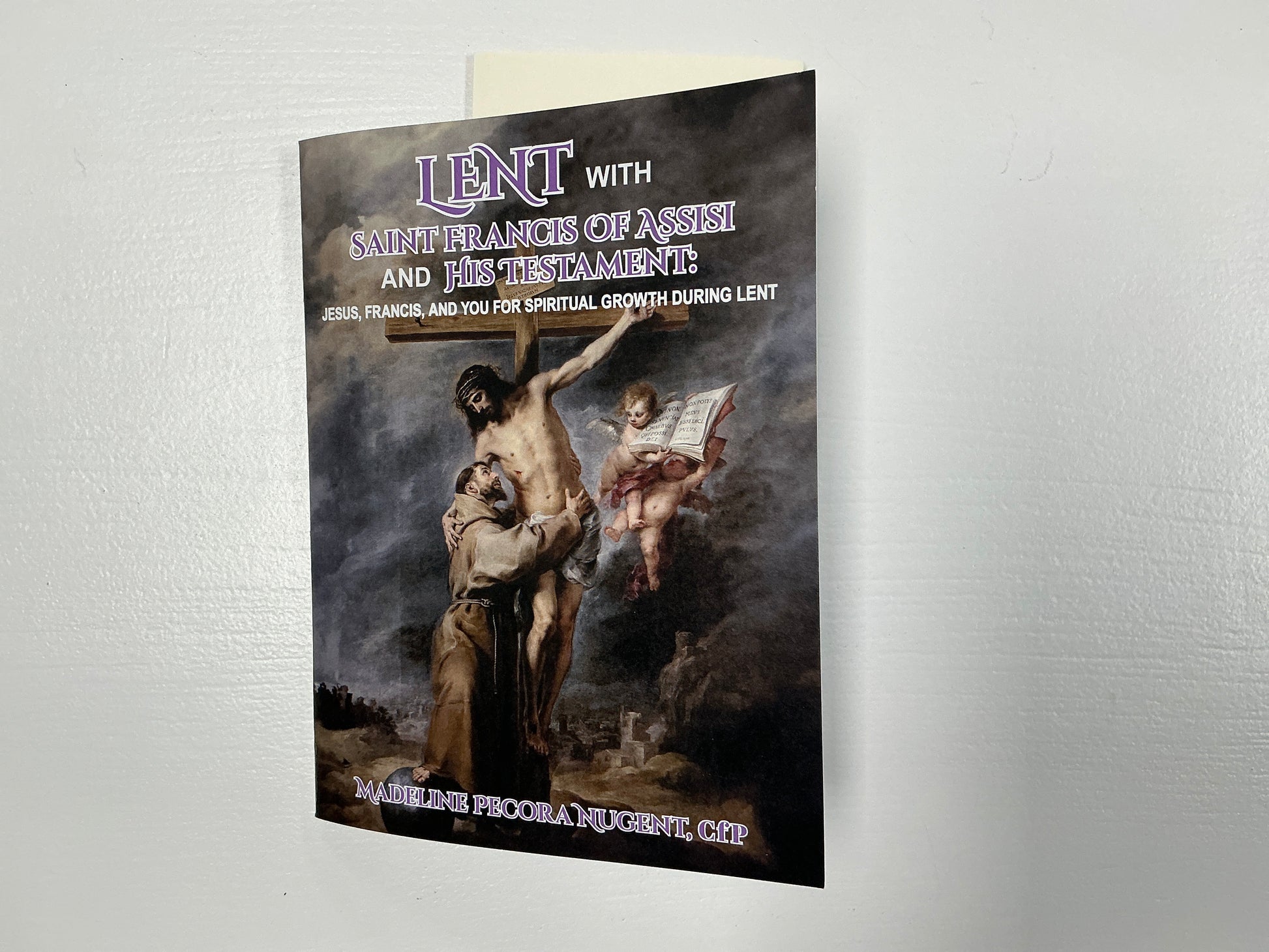 Booklet titled 'Lent with Saint Francis of Assisi and the Testament' on a textured white background