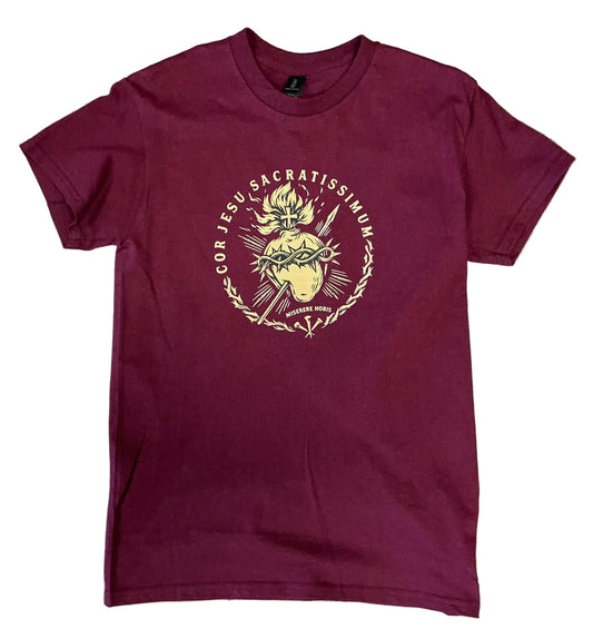 Maroon t-shirt with graphic design on a white background 