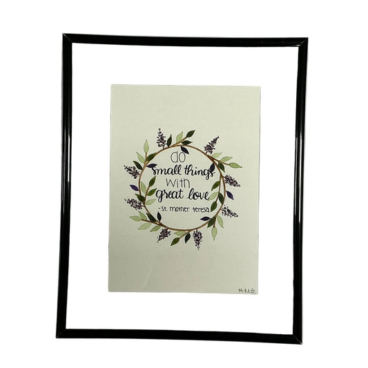 Framed artwork with decorative text and floral design on a light background