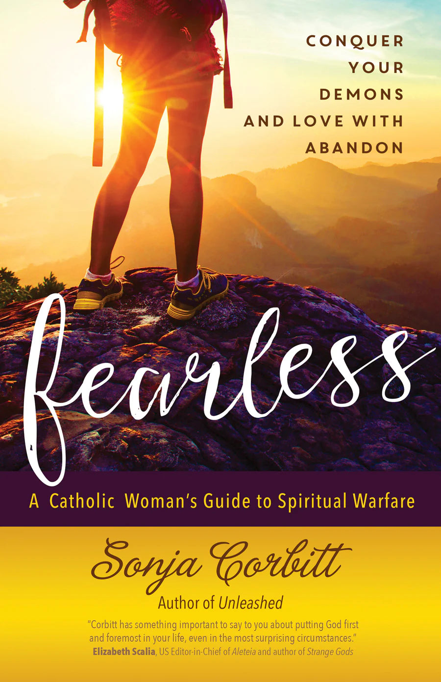 Book cover for 'Fearless: A Catholic Woman's Guide to Spiritual Warfare' by Sonja Corbitt, featuring a hiker's legs against a glowing sunrise over mountains, with the title in large white script and the author's name on a yellow band at the bottom.