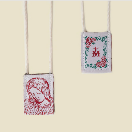 Two small pouches with religious designs on a beige background