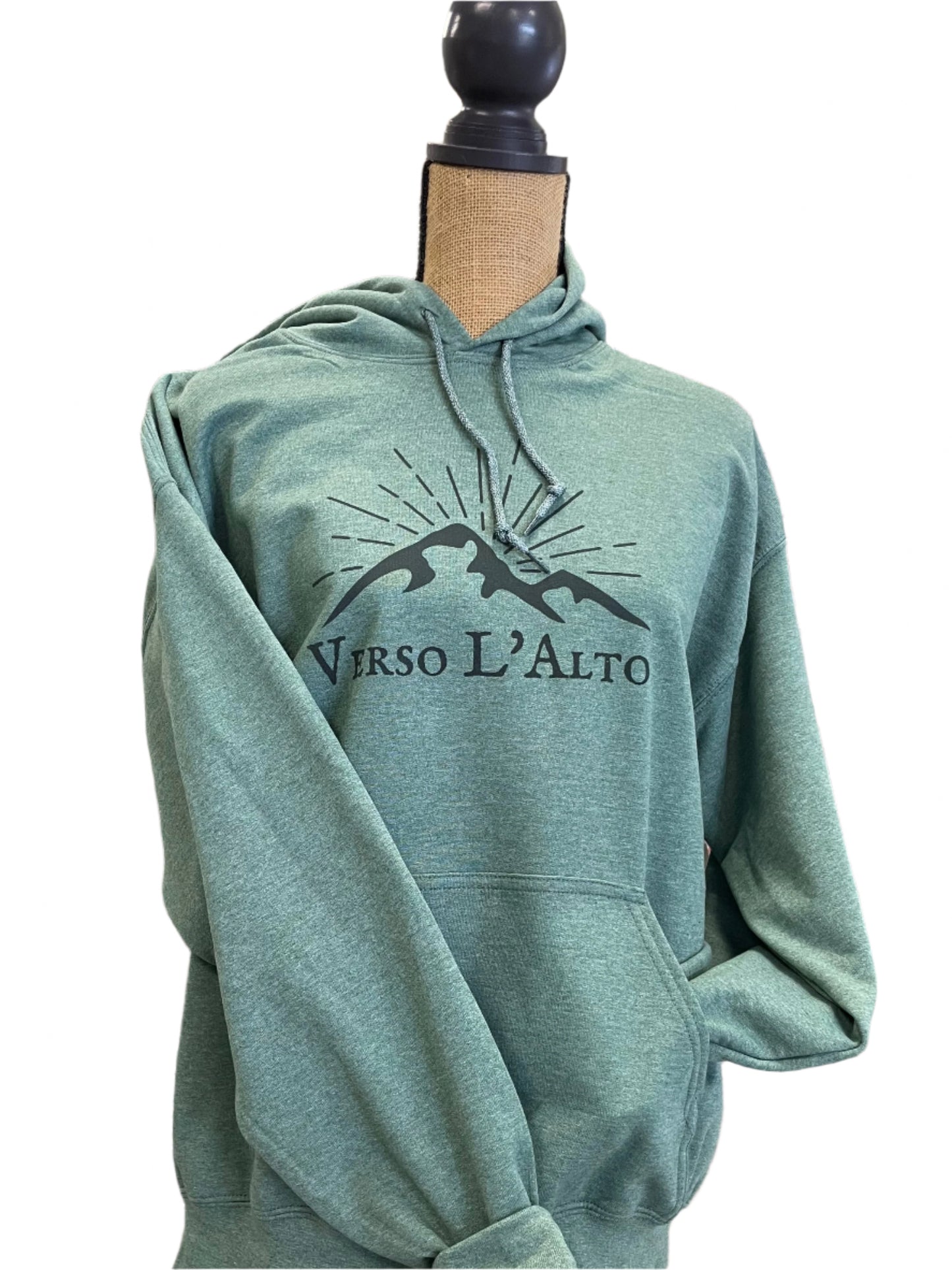 Green sweatshirt with a logo on a mannequin in a store setting