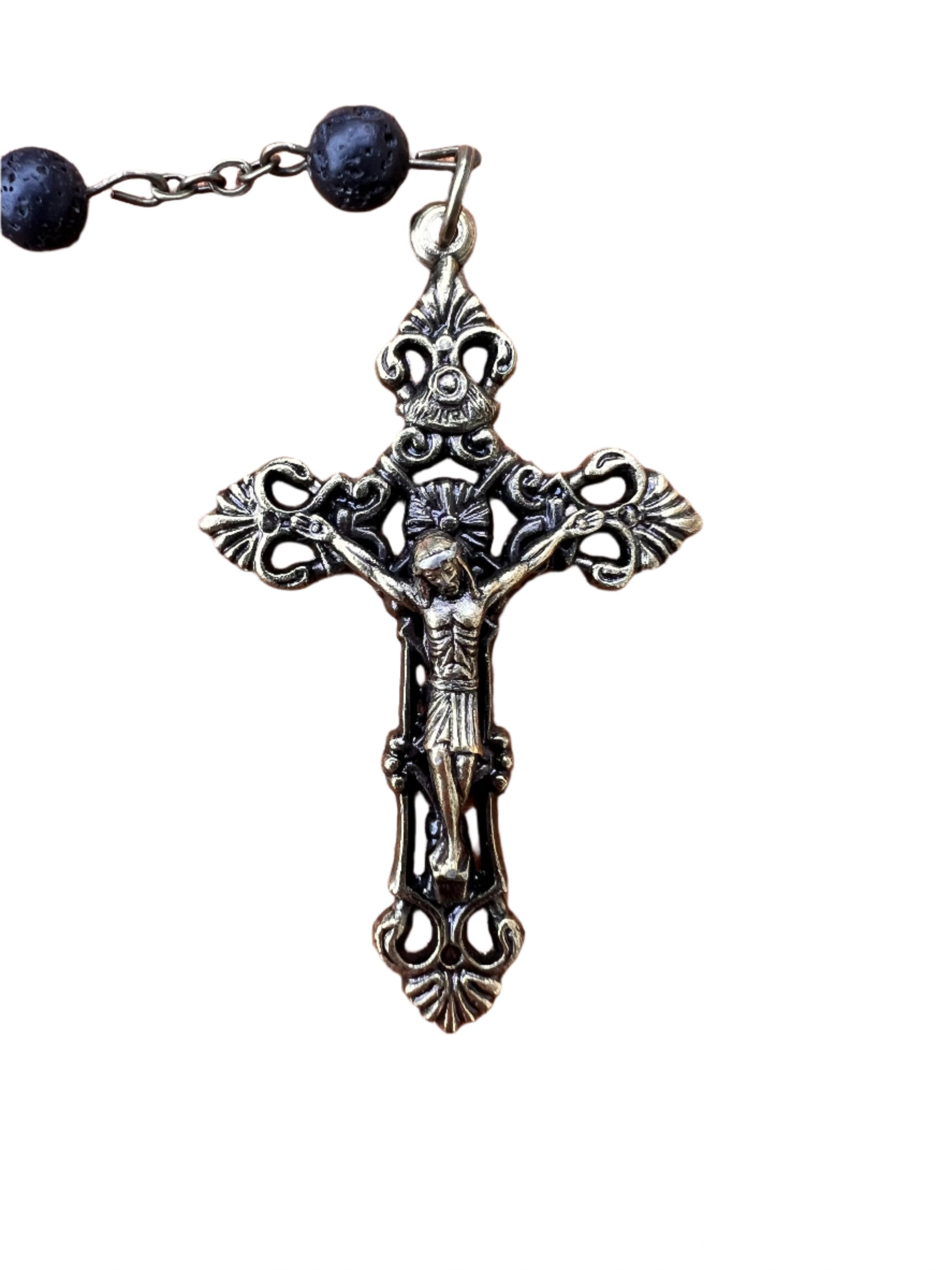 Decorative crucifix with black beads on a white background