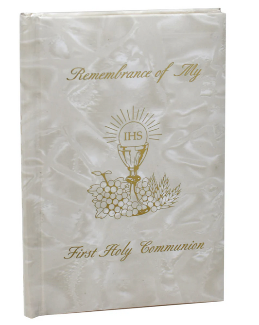 White book with first communion and gold design