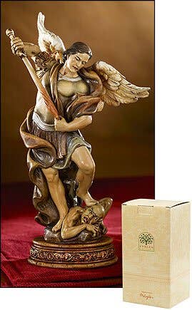 Saint Michael statue with box on red carpet