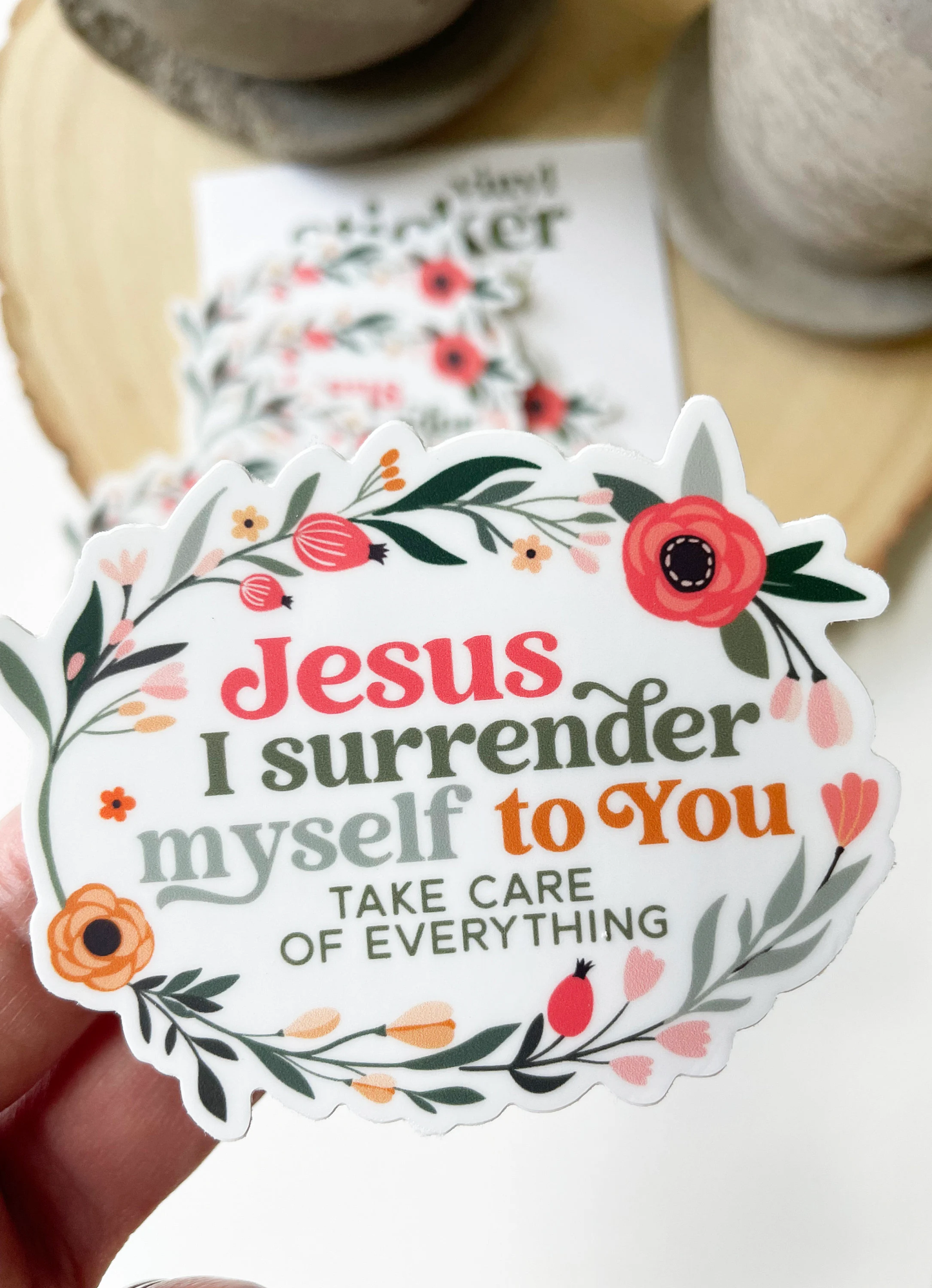 Decorative sticker with floral design and text on a white background