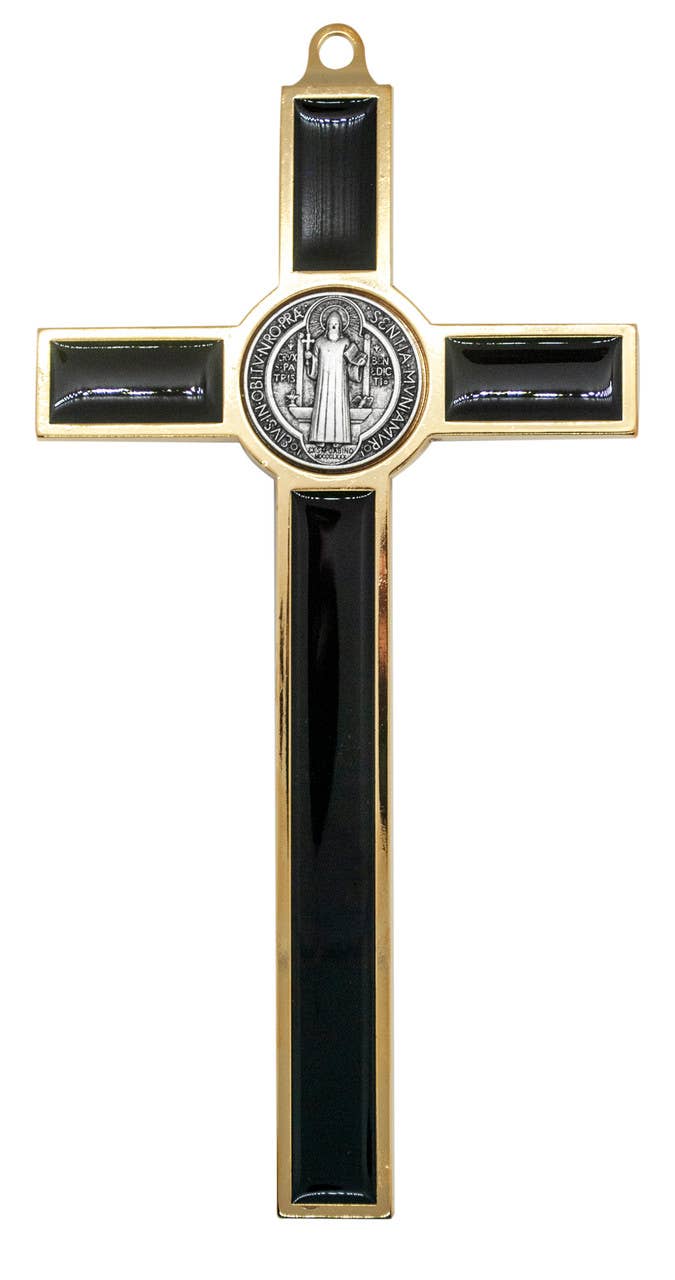 Decorative cross with black accents and a central emblem on a white background