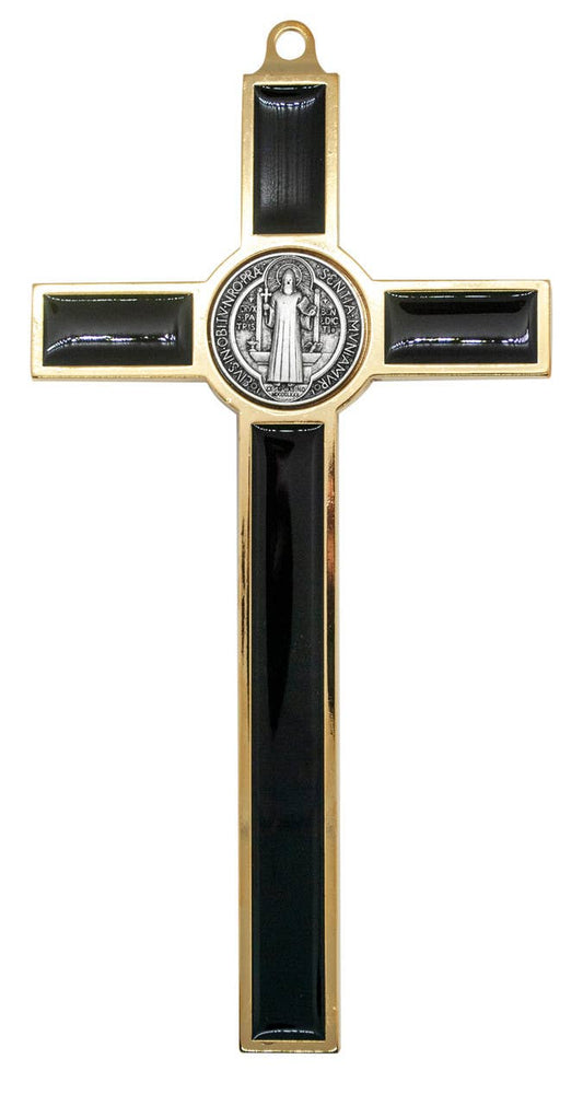 Decorative cross with black accents and a central emblem on a white background