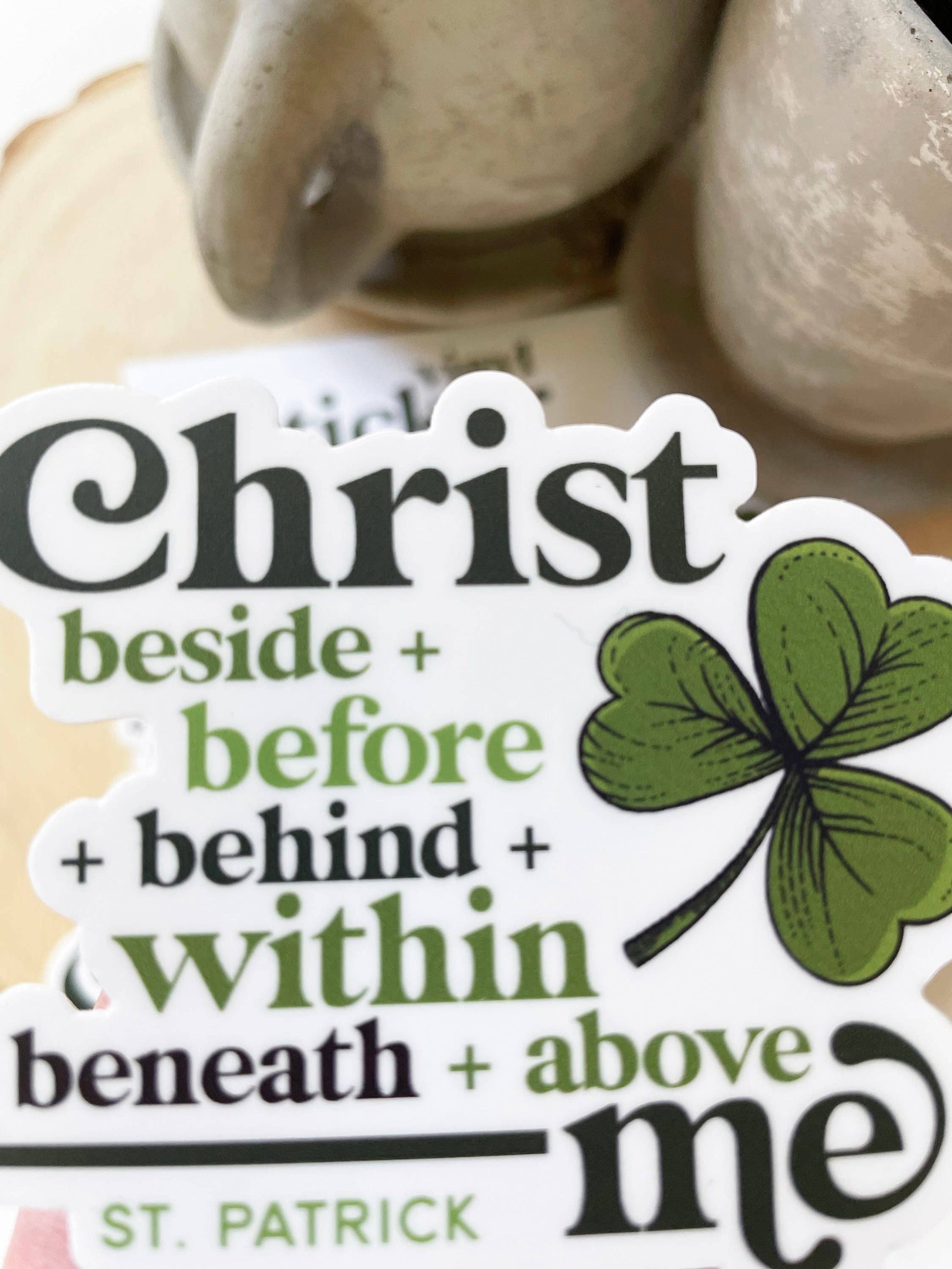 Sticker with text 'Christ beside + before + behind + within + beneath + above me' and a clover leaf, inspired by St. Patrick.