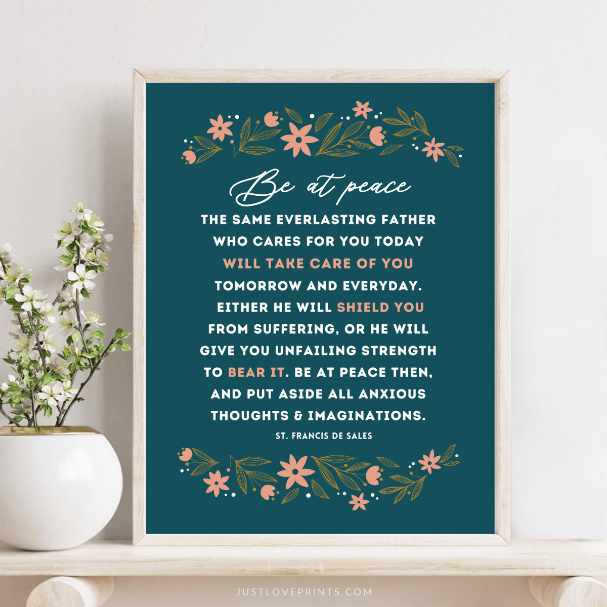Be at peace with navy blue background and floral design framed on wood table by plant