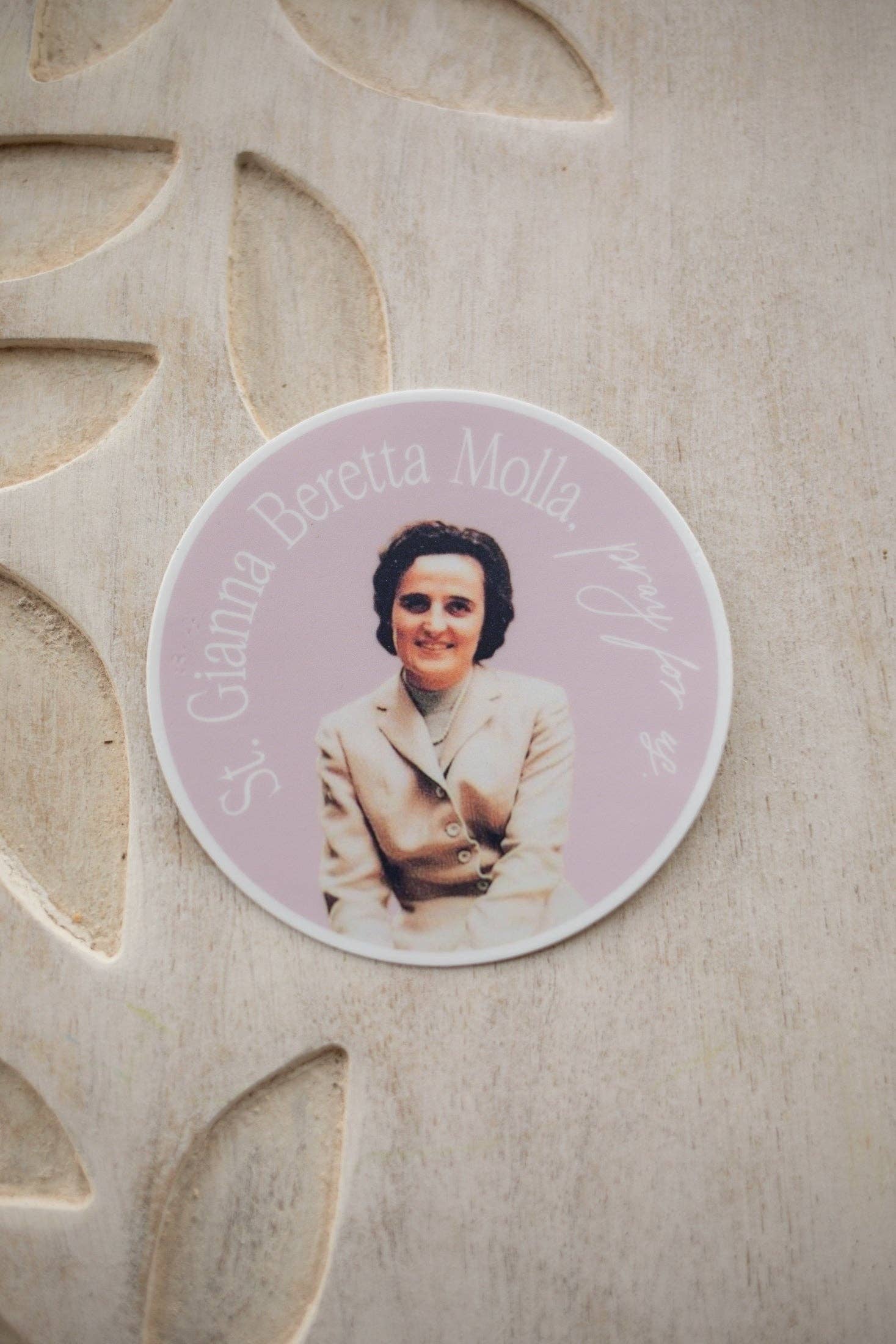 Circular photo of a woman on a decorative stone surface