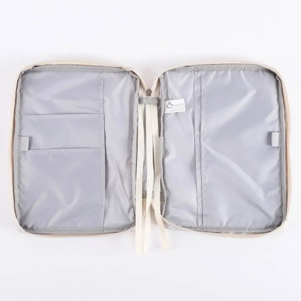 Open Bible cover organizer with compartments on a white background