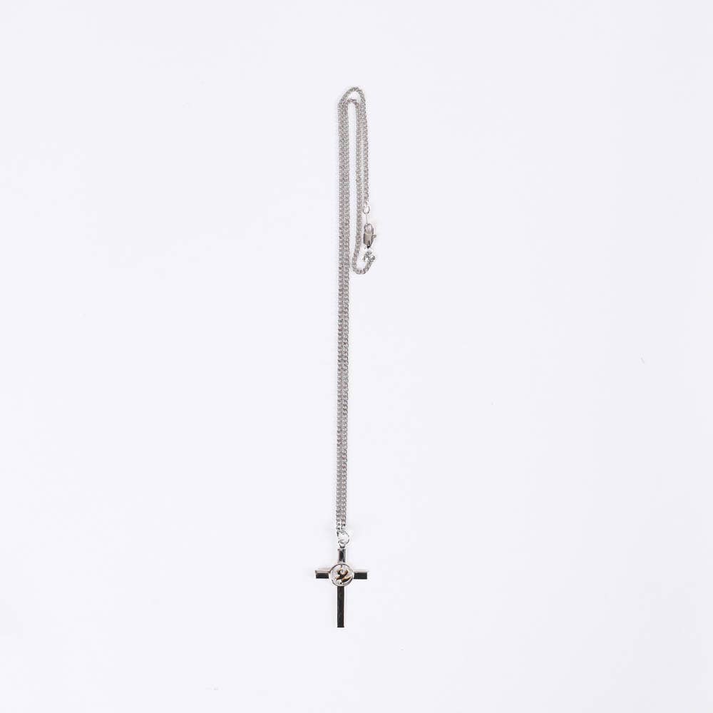 Silver chain necklace with a cross pendant on a white background